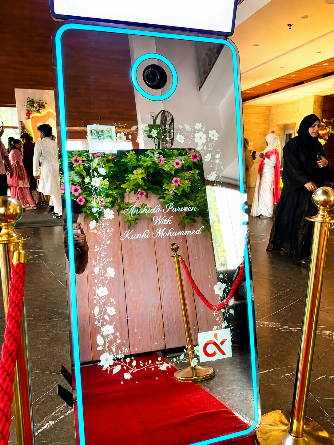 Gen Z Magic Mirror photobooth with cyan LED frame at CK Convention Centre Palapetty wedding