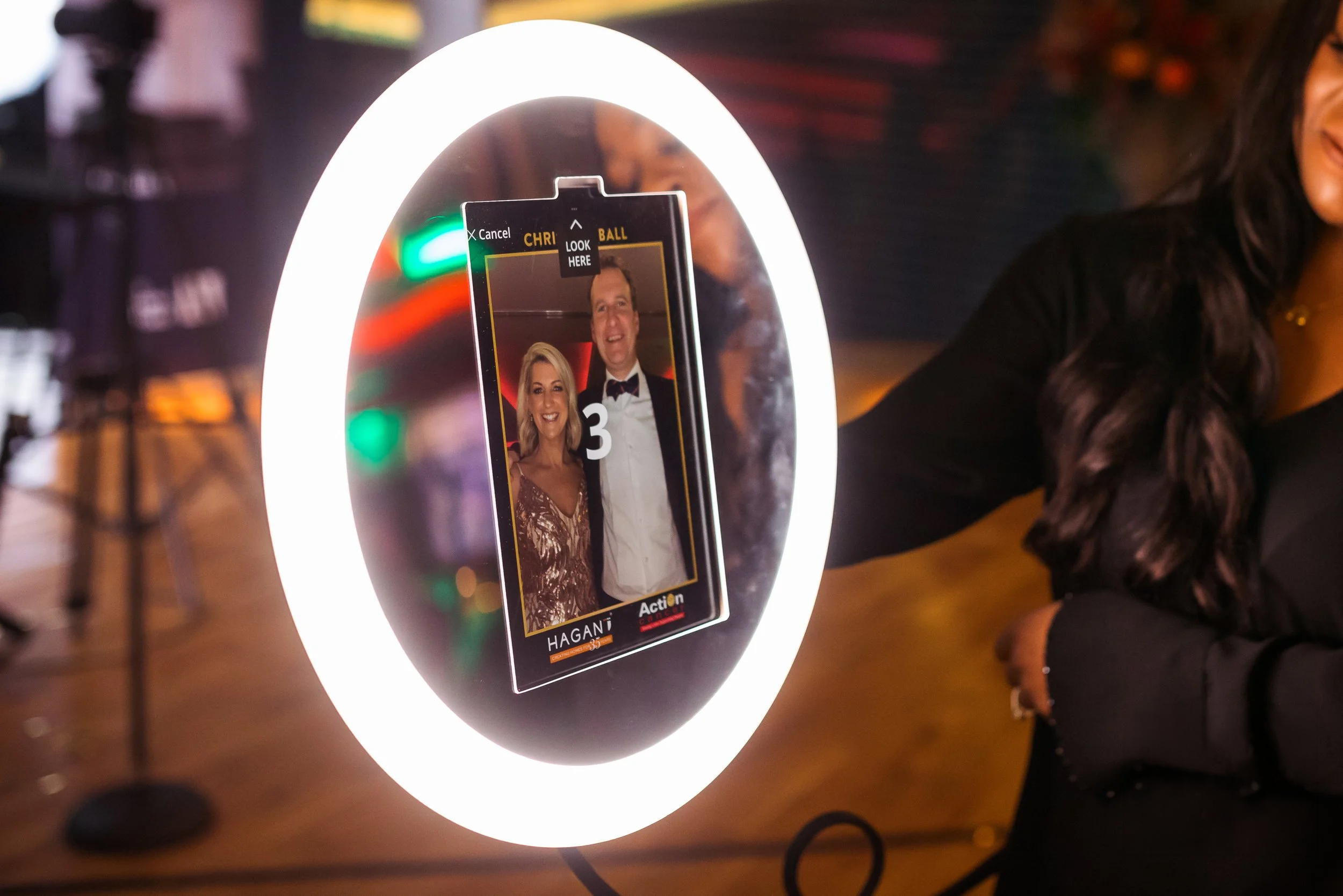 PartyBooth Roaming Glow Photobooth ring light in use at an event